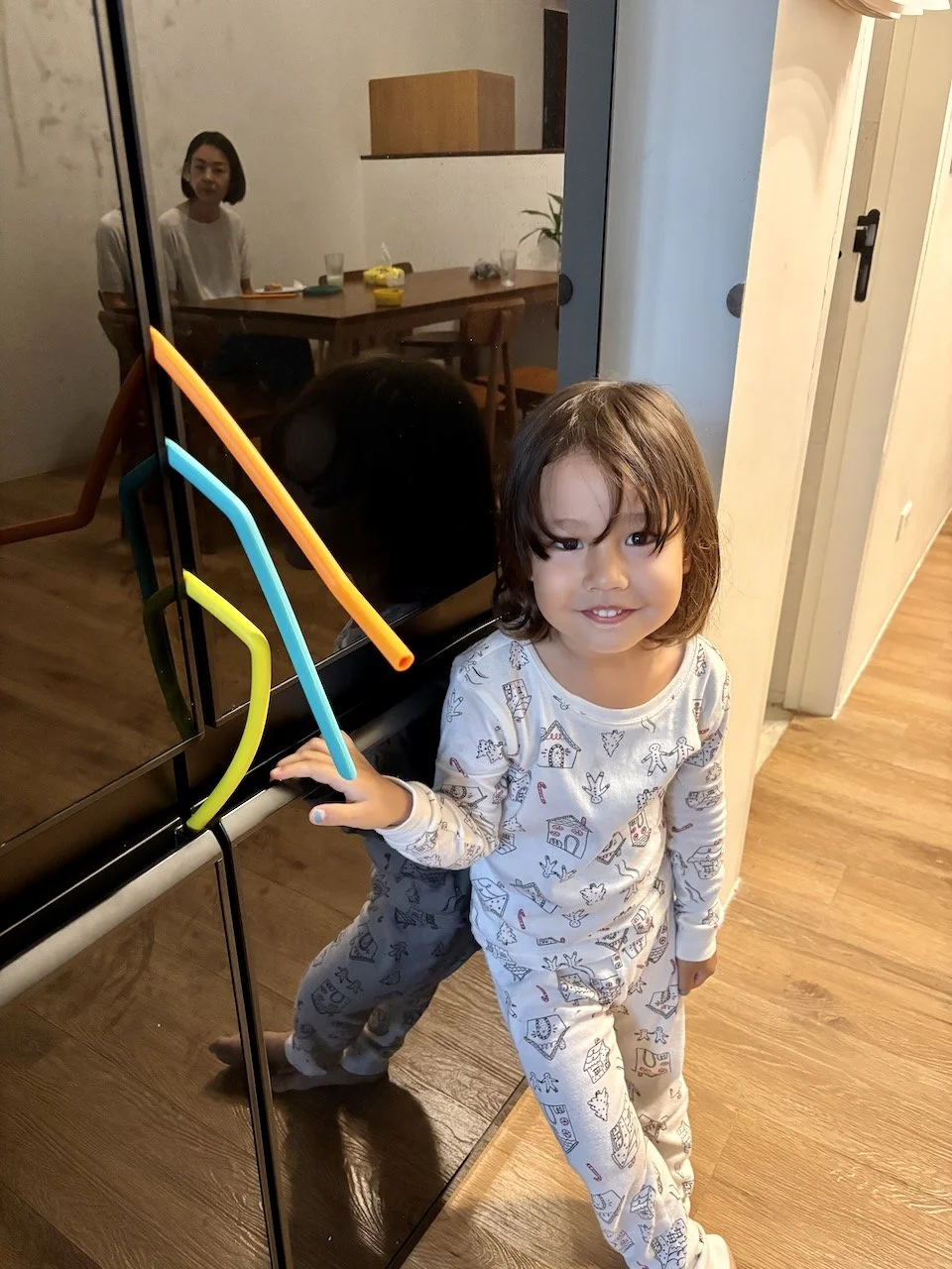 Lucy made a "snake" with the straws and the fridge doors.