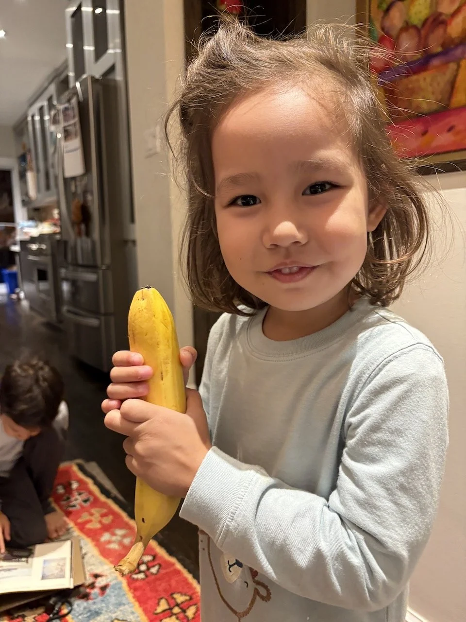 Someone's hungry: she scarfed down a whole (giant) banana upon arrival.