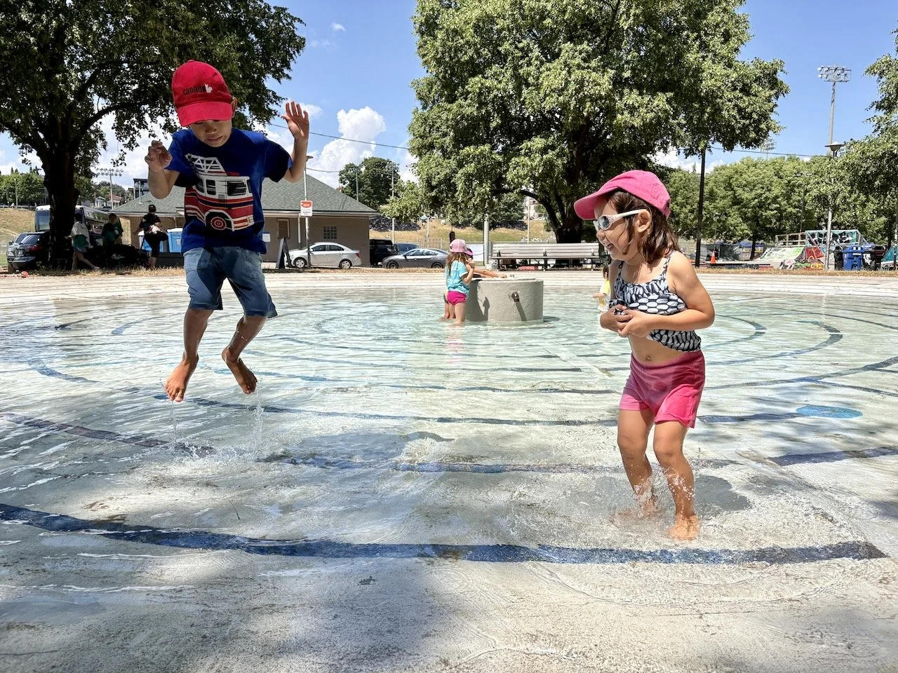 These two were the first into the freezing (yet full-sun) splash pad after it was refilled for the afternoon.