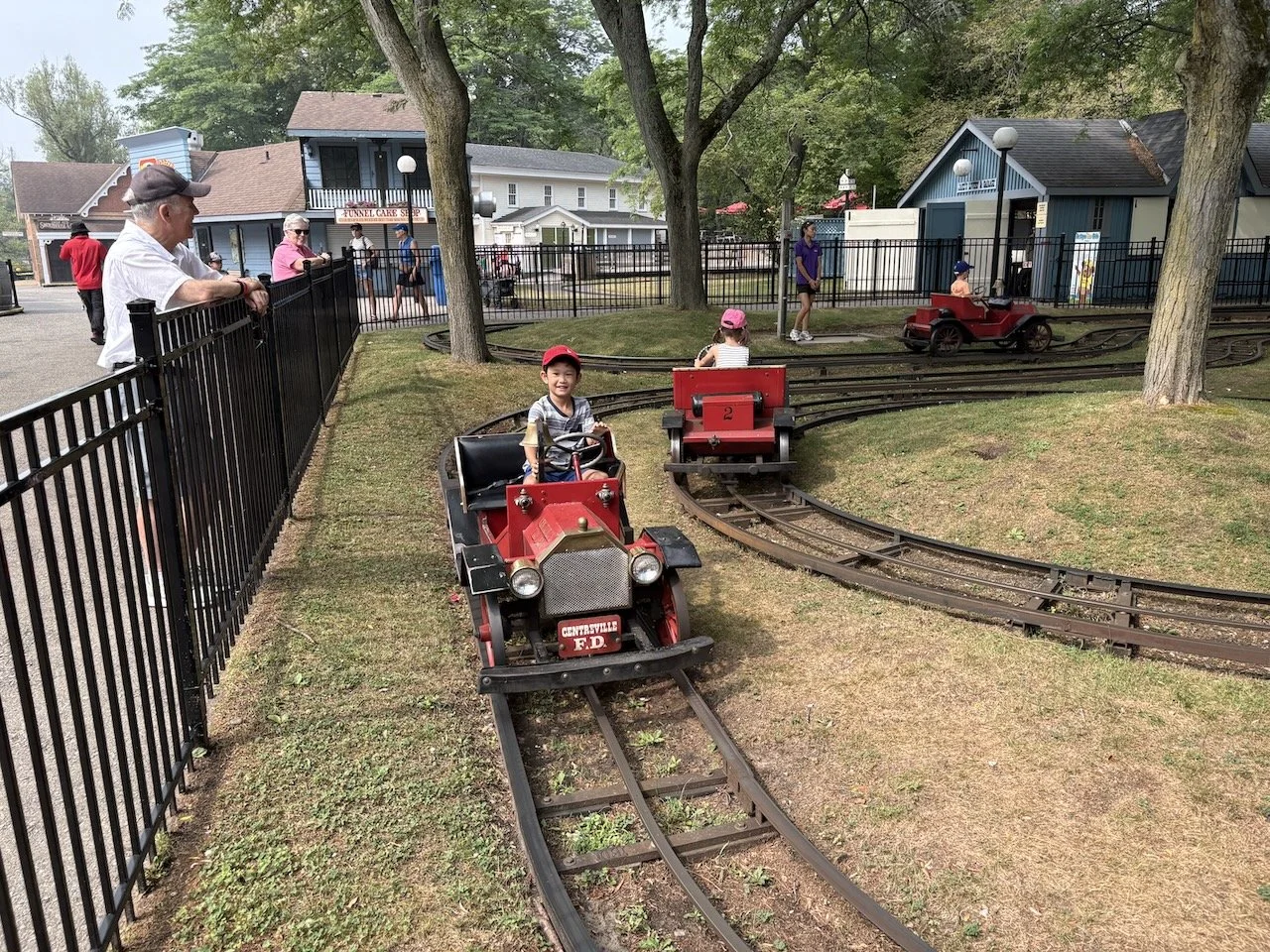 And this time, Lucy (in the passing car) was old enough to enjoy all the thrills, too!