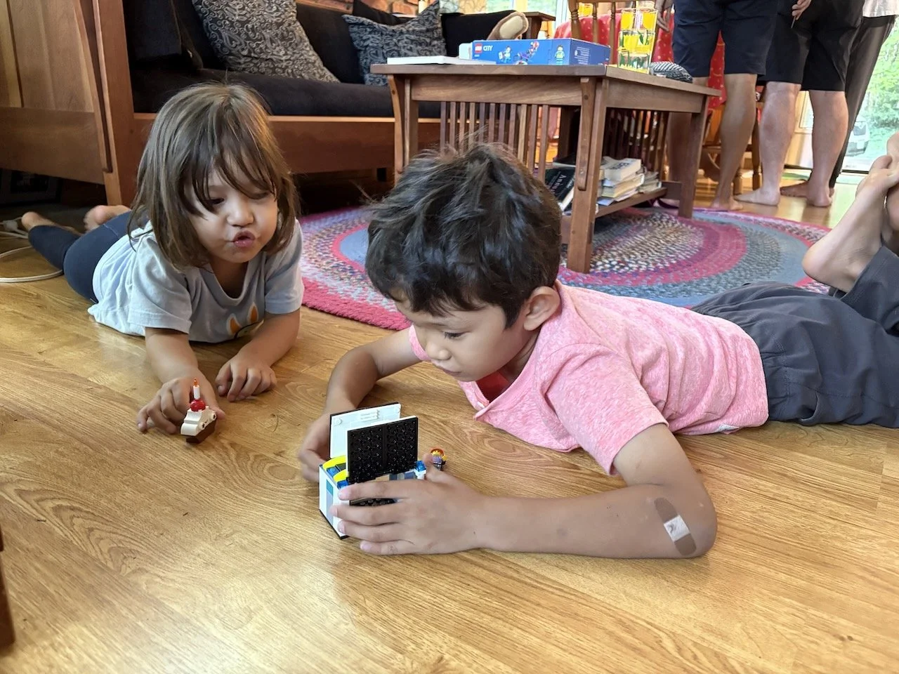 Enjoying their new LEGOs.