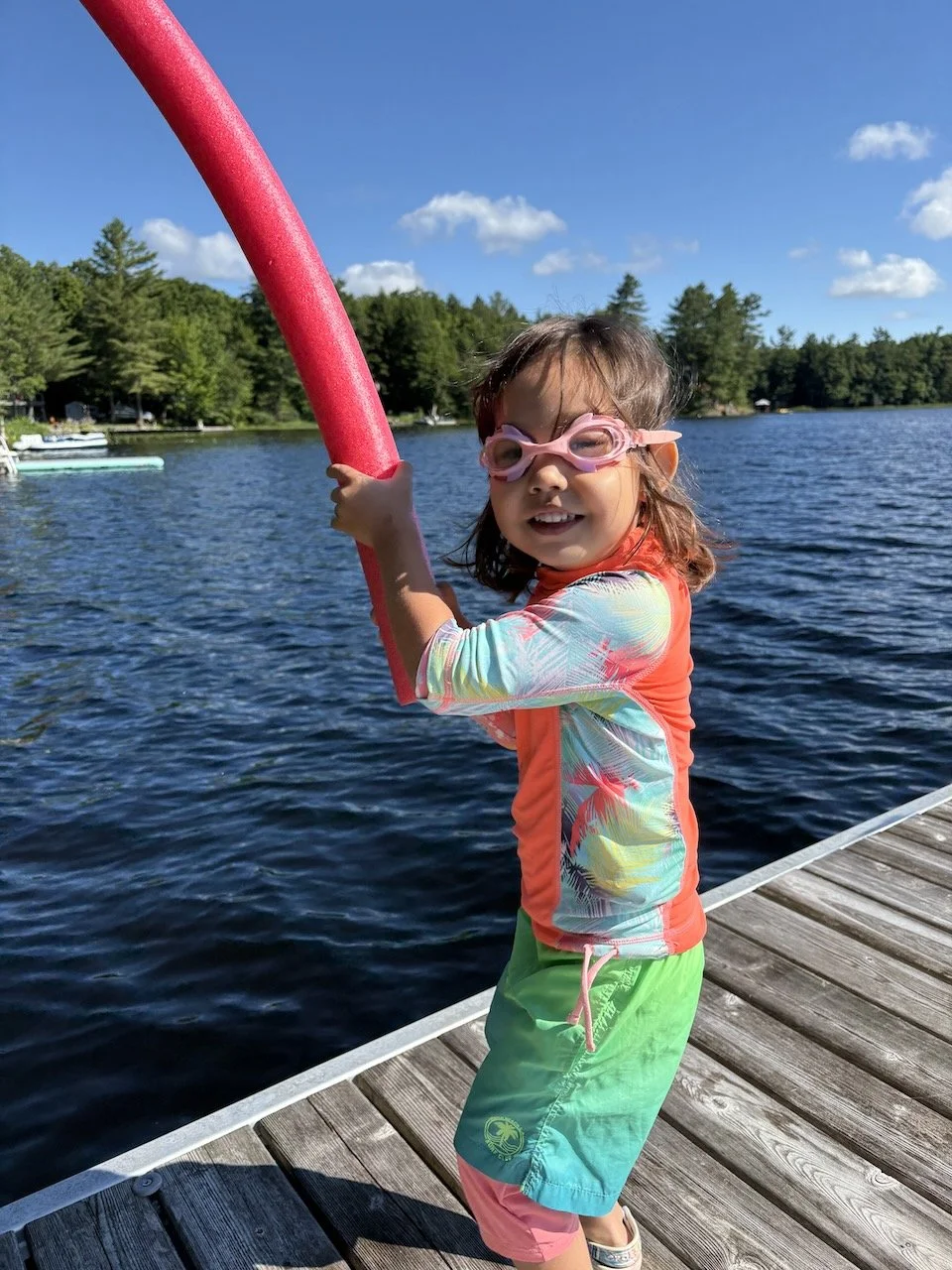 Lucy will help by handling the noodles. (Note: she's wearing two layers of swim suits.)