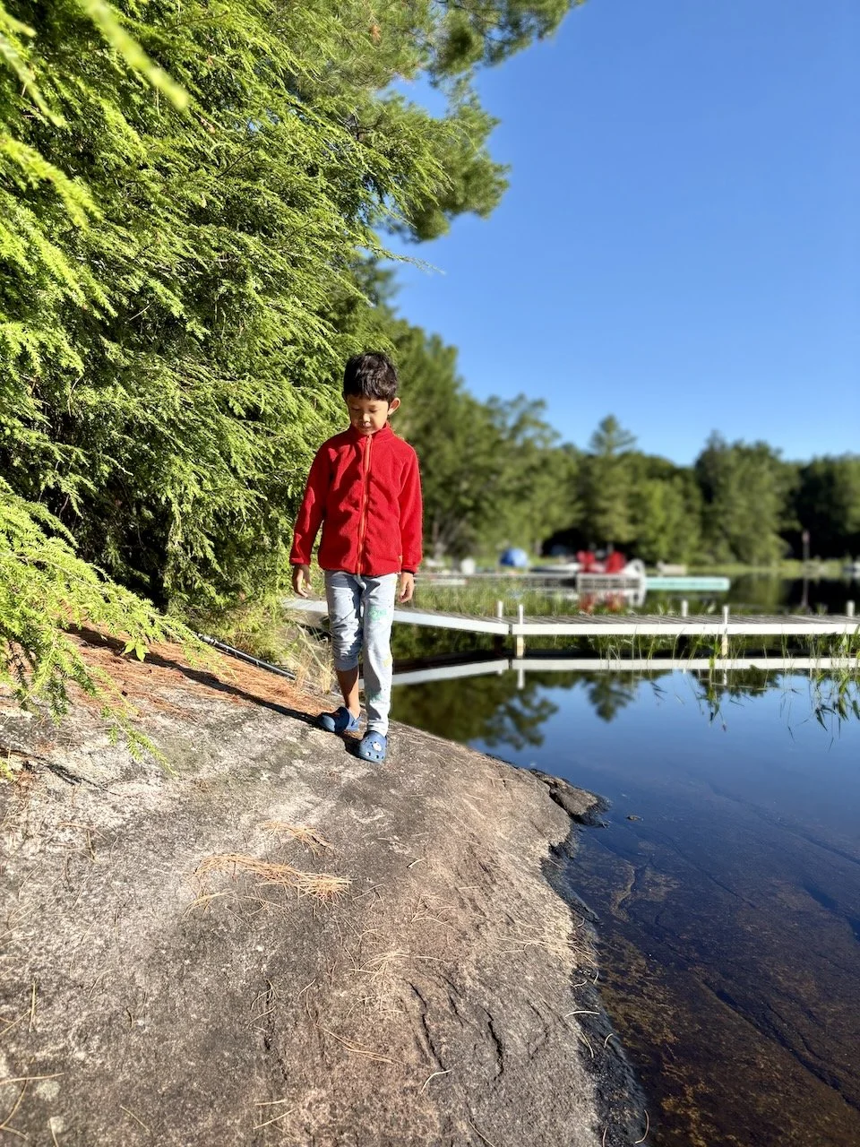 Walking carefully along the rocks to the "beach".