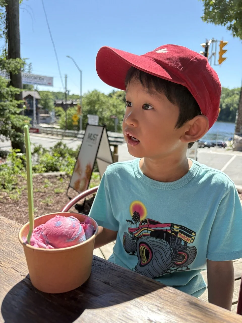 Stopping for an ice cream treat... but regretting his choice of flavor.