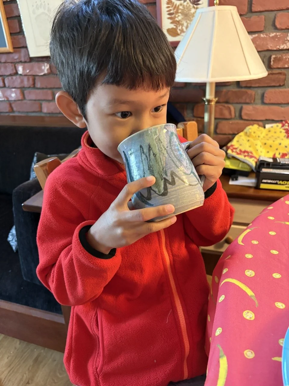 Enjoying milk in these magic mugs.
