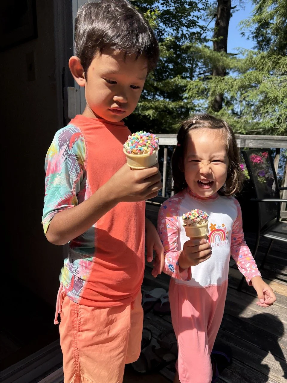 Enjoying an ice cream cone with sprinkles - how deluxe!