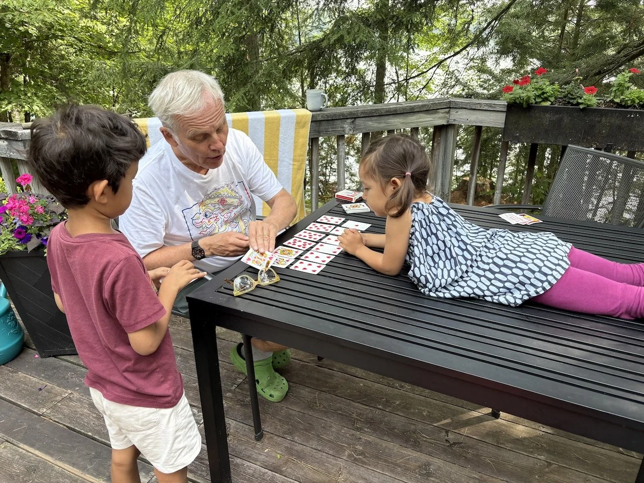 Lucy's getting her first lesson in playing cards from Grandpa. Never too young to start!