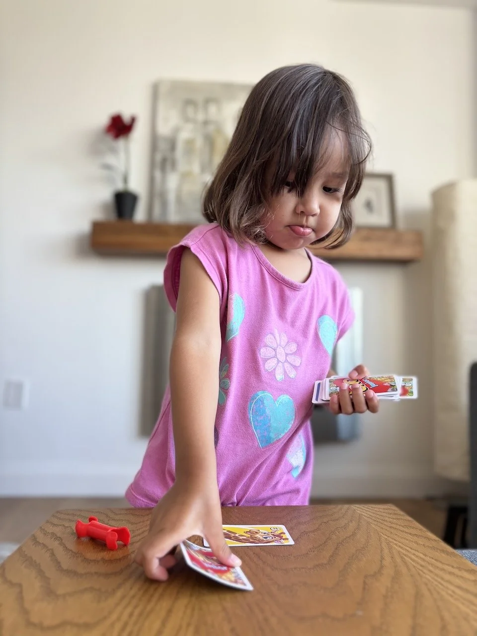 Lucy quickly caught on to UNO, and didn't want to stop playing.