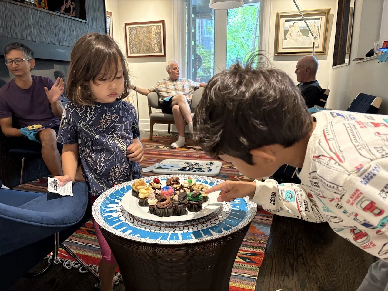 Seeing a few more family friends... and Granny's spoiling the kids with the too-posh desserts.