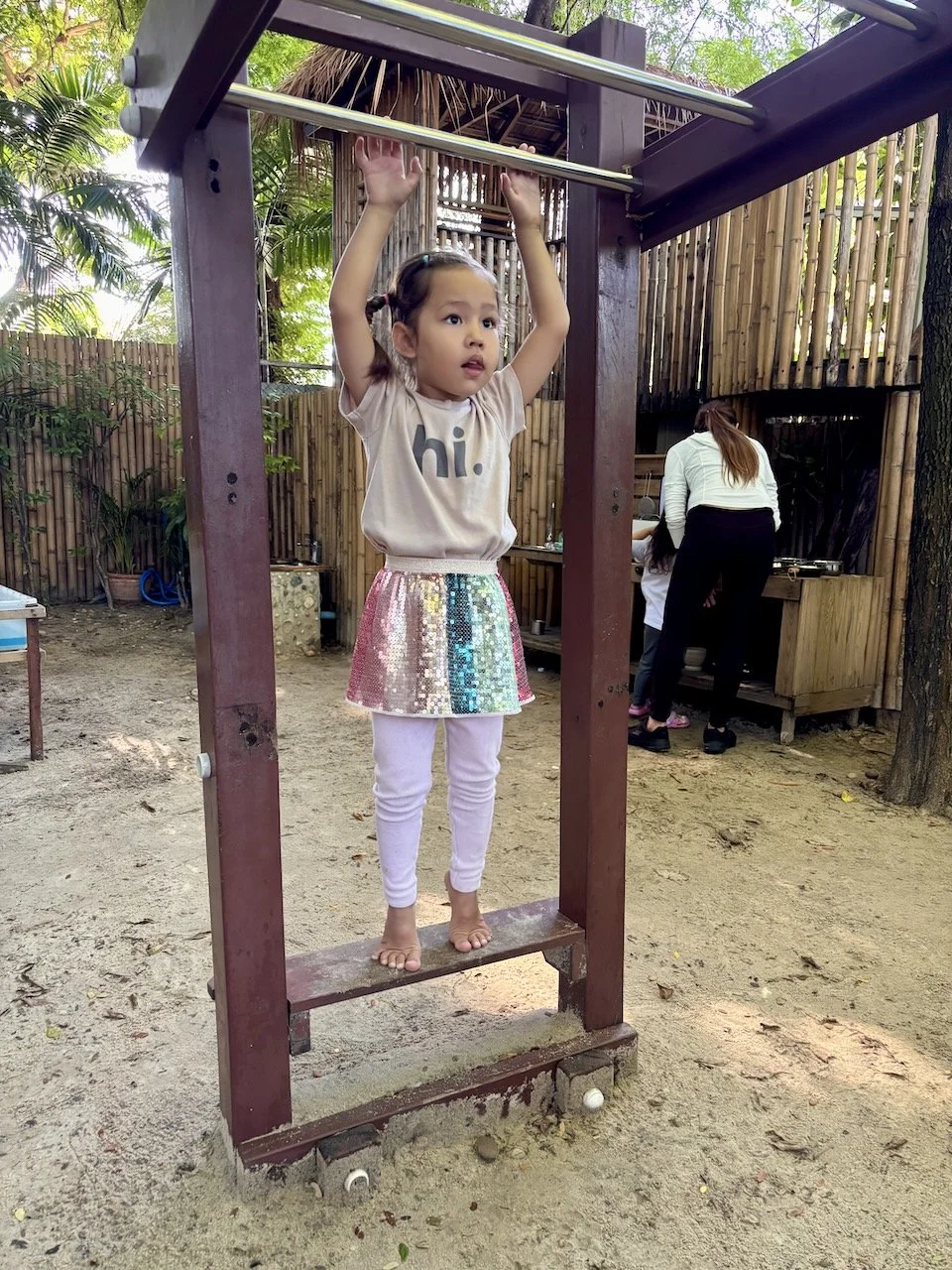 Working up the courage on the monkey bars.