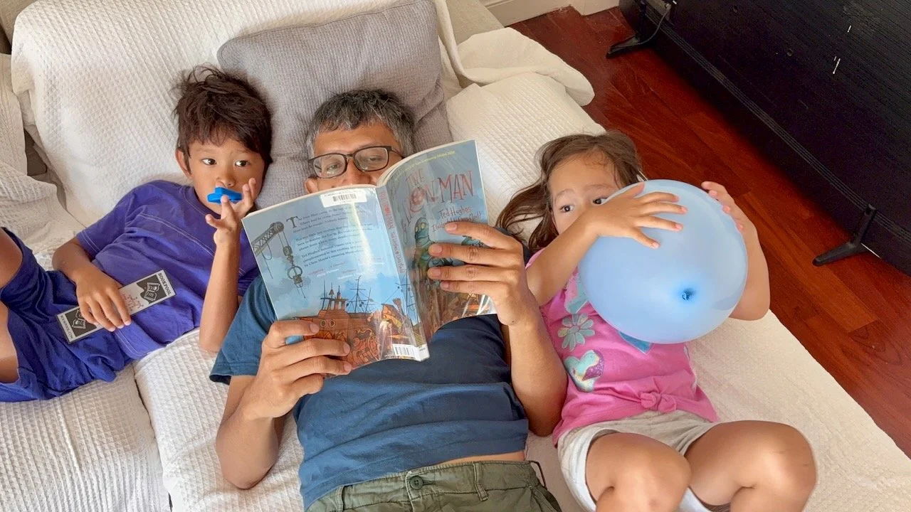 Reading the chapter book that Arlo checked out from the library earlier this week.