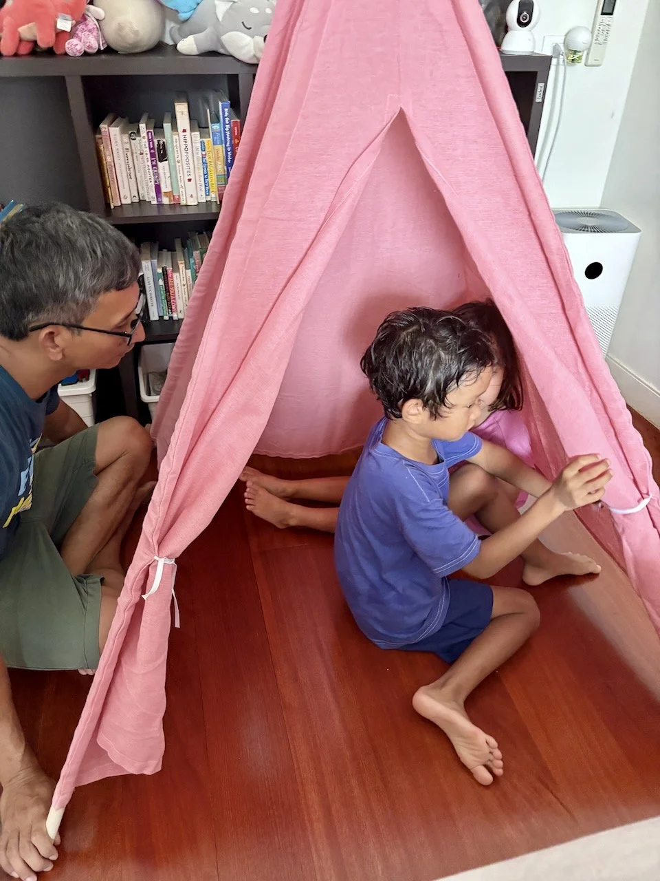 Assembling the teepees that arrived. They're an attempt at instilling a calm down corner in their rooms.