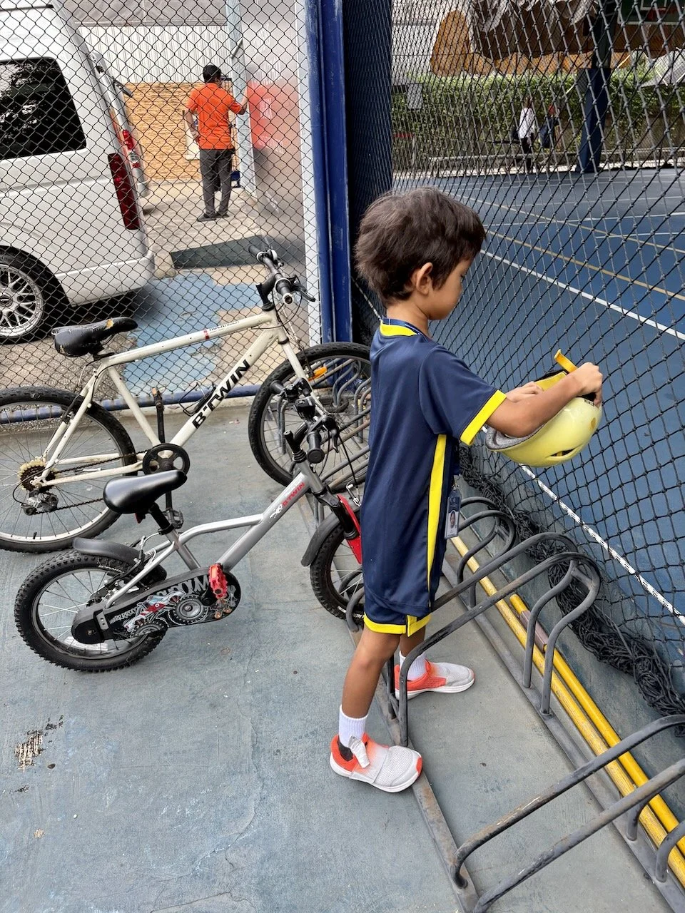 Parking his bike the next morning...