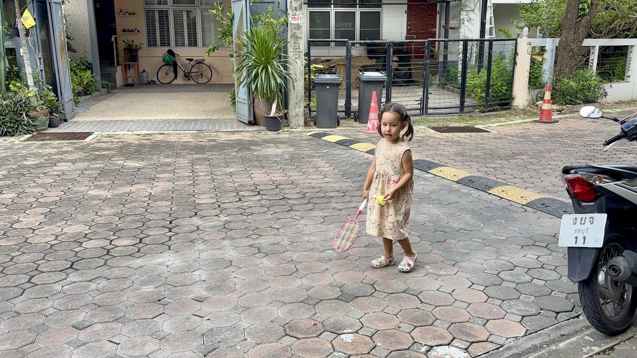 Lucy's practicing her badminton skills.