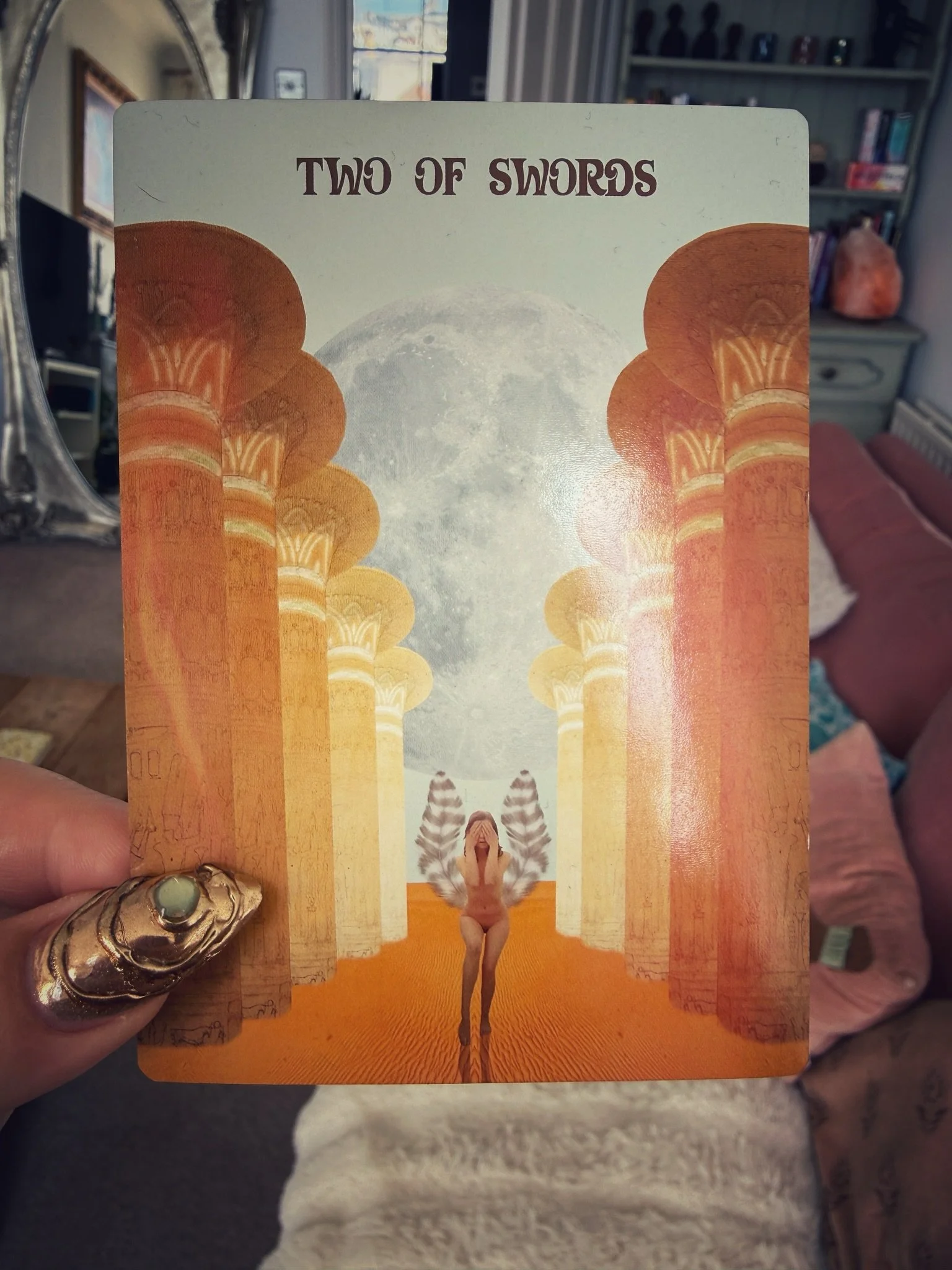I pulled the Two of Swords for a client the other day.

A woman standing in the ancient temple of Karnak in Luxor, wings spread, eyes covered. 

The enormous columns towering around her represent the ideas and decisions pressing in from every directi