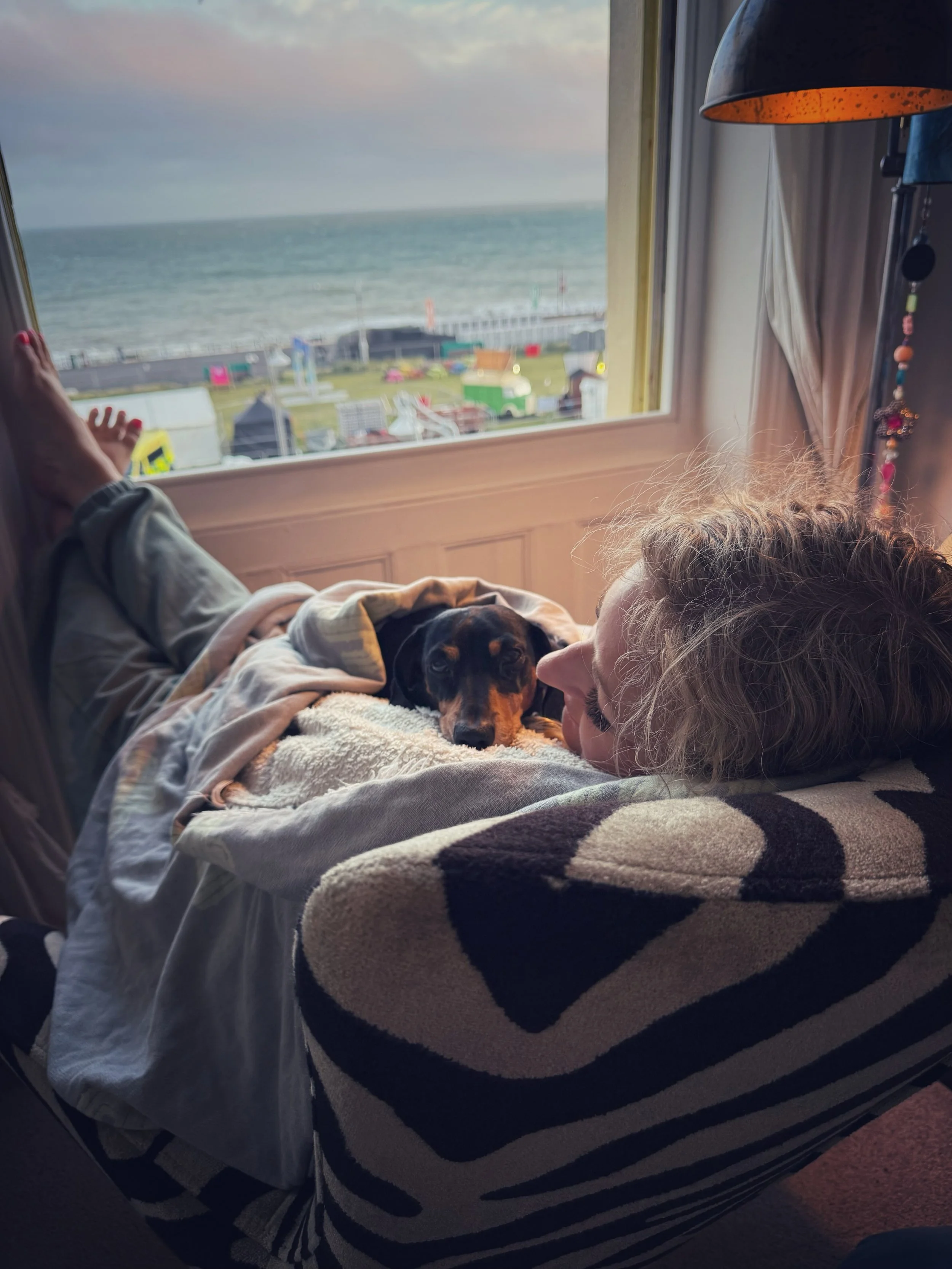 What would be possible for your business if you stopped doing it all on your own?

This week I hosted a live event, and as a Projector, 5 days of holding space leaves me energetically spent.

Last night, after the event, I curled up with Rudy, watche