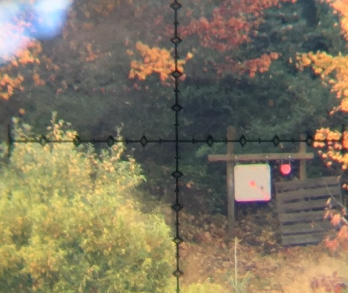 The splash from a 6.5 Creedmoor at 600 yards is very obvious, even in this grainy cell-phone-through-the-scope photo. With my eye to the scope, the scoring rings and numbers (barely visible at all here) are clear and legible. 