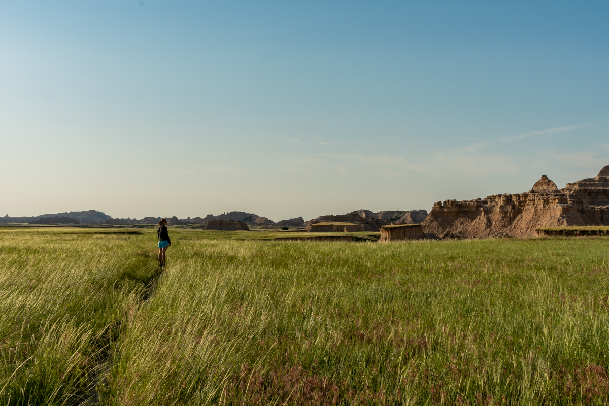 Woman Looks Out Over Badlands from Trail