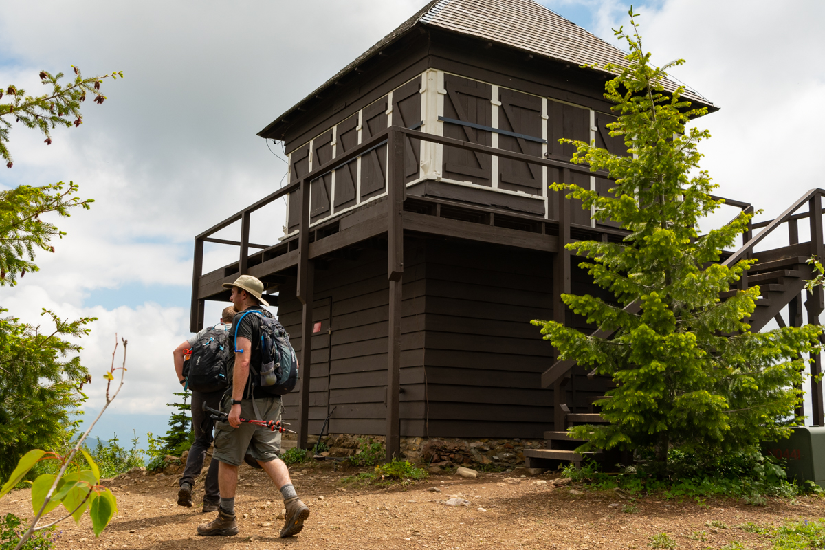 Two Men In Front of Apgar Lookout Tower