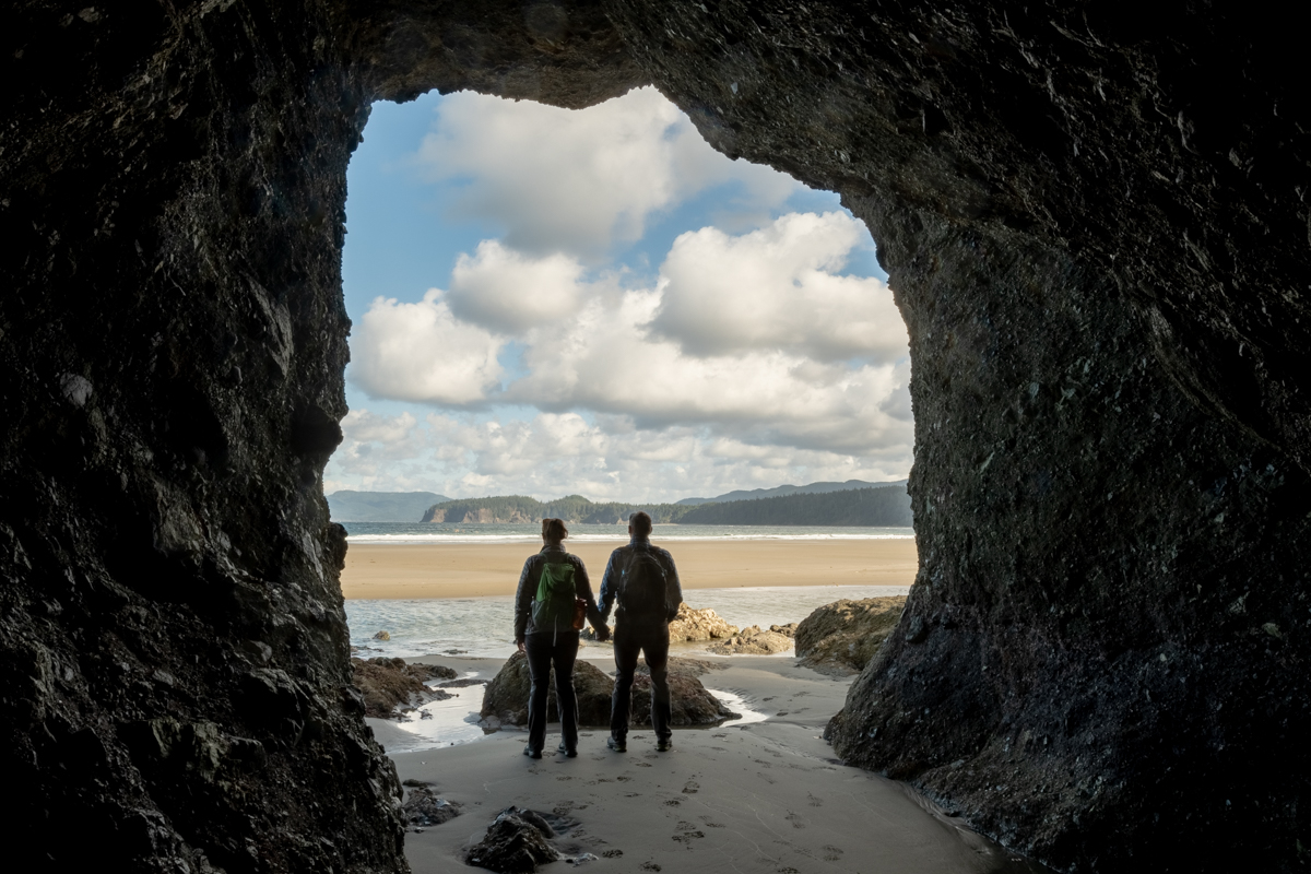 Standing in a cave at Point of the Arches