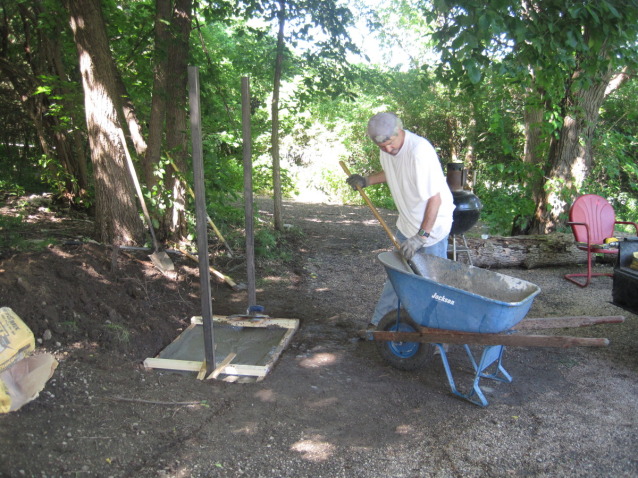 The HusbandlLaying the found for the barbecue