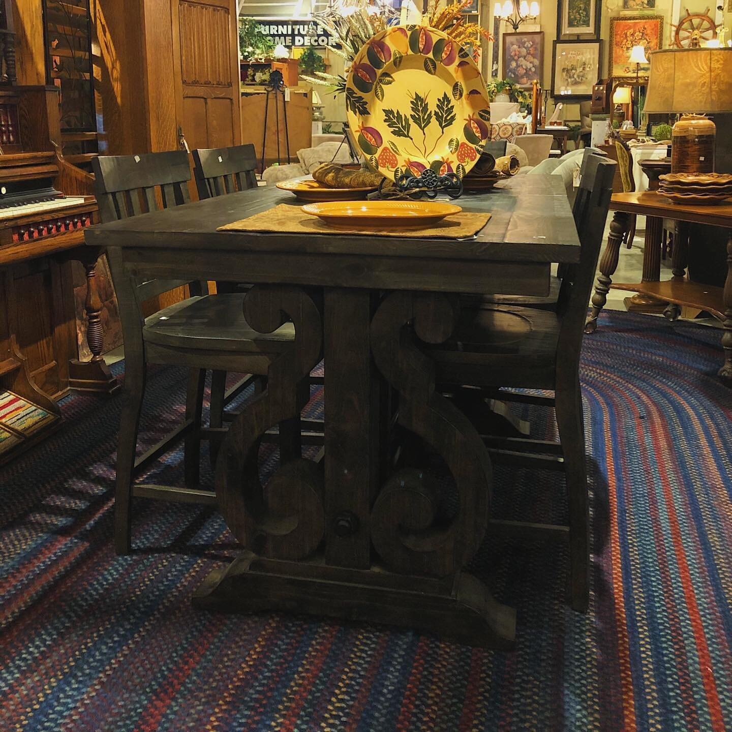 Dark woods with jewel toned colors add to the intimacy of a space. 🖤 

This gorgeous Dark Wood Dining Table comes with six bar-height chairs for $2,195.95, perfect for meals with the people you love. 

It features an industrial touch with a thick ro
