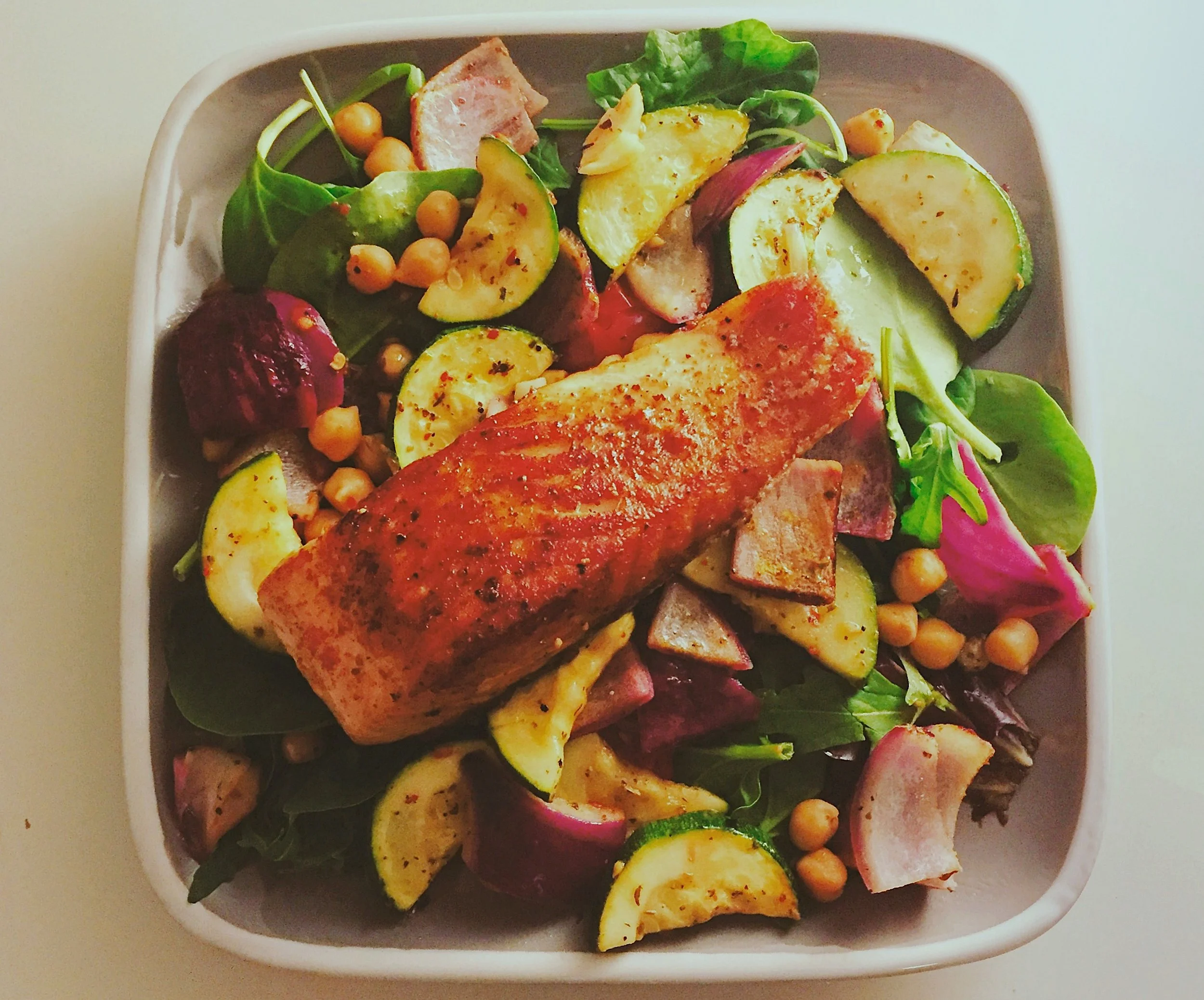 Pan-seared salmon with chickpeas and roasted vegetables