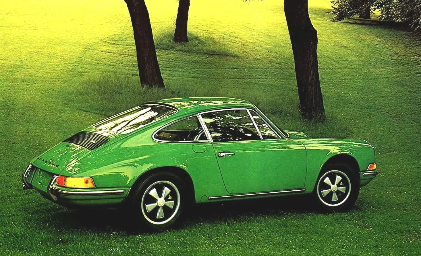 Original Porsche 911 magazine ads from the 1960s, G-Body era, and 964 series, highlighting air-cooled performance and classic copywriting.