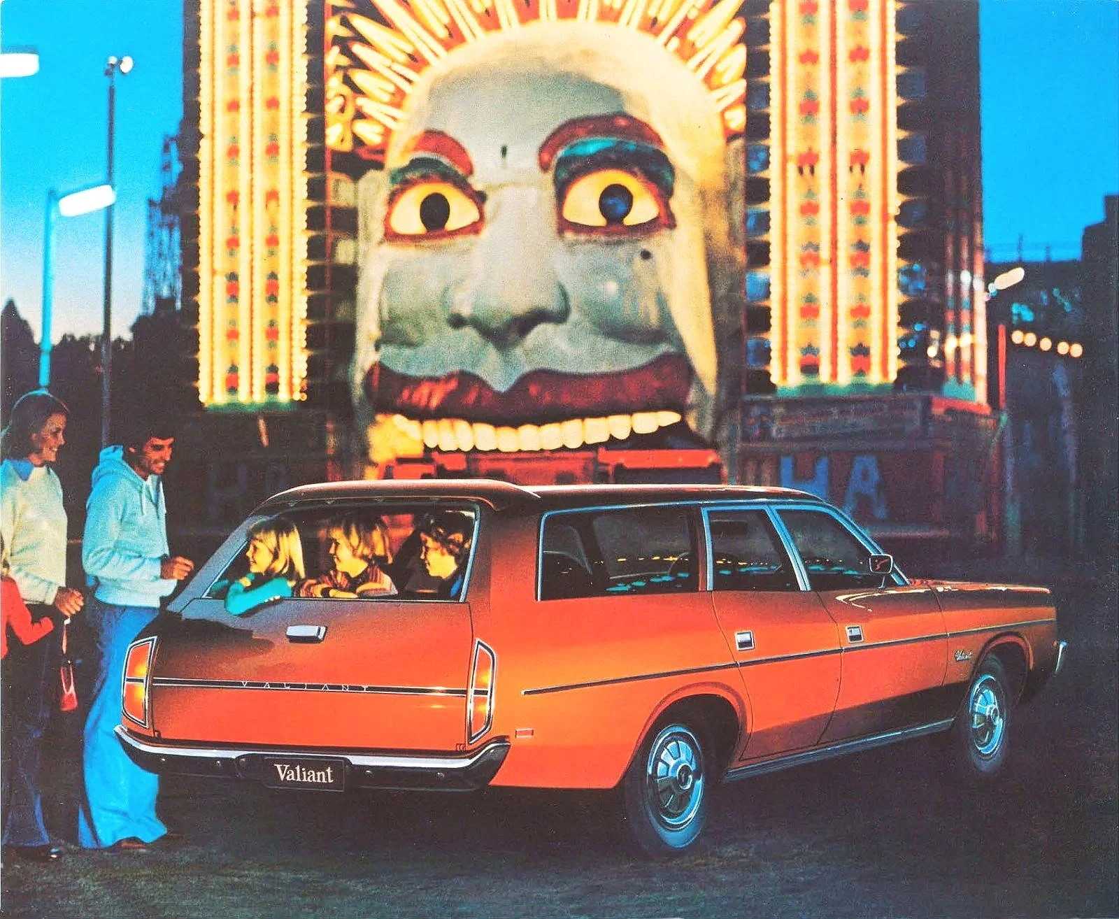  1977 orange Chrysler CM Valiant station wagon photographed outside Sydney’s Luna Park. Original print advertisement. 