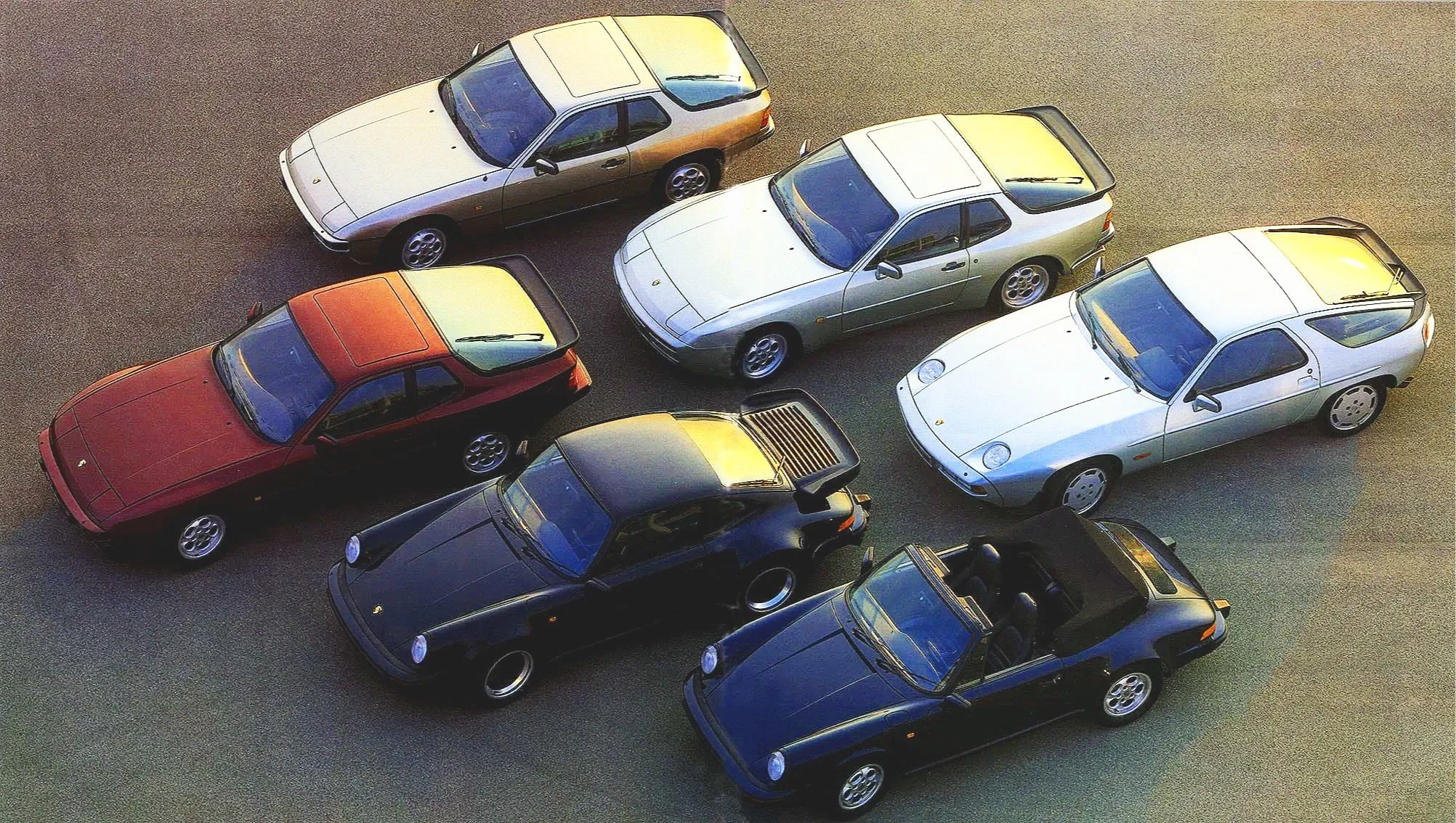 orsche transaxle era print ads for the 924, 944, and 928 Land Shark, showcasing front-engine water-cooled grand touring heritage.