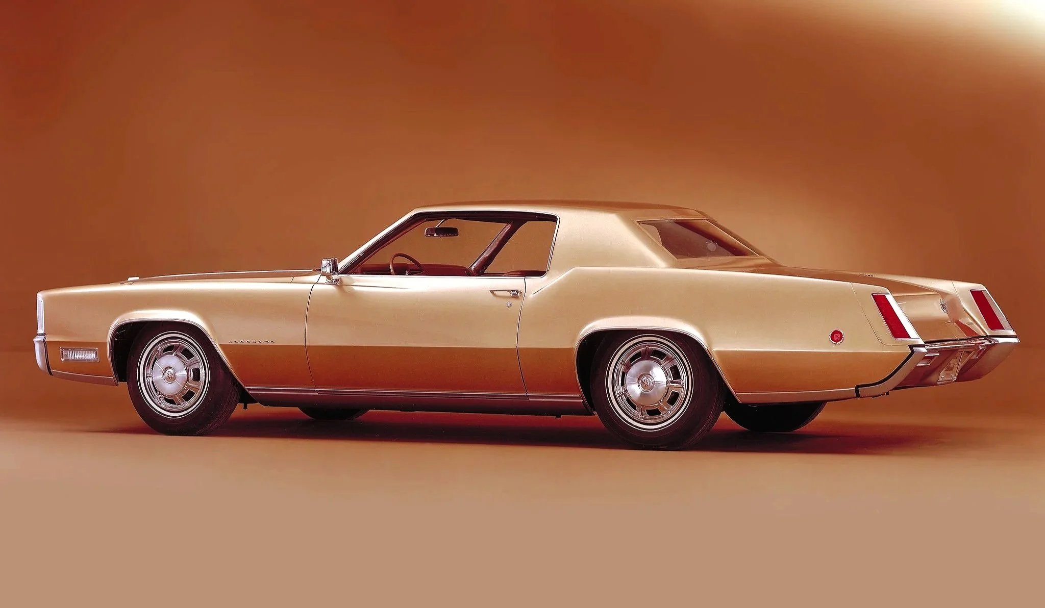 Link to gallery of vintage Cadillac Eldorado print ads (1960s-1970s). Image shows a classic front-wheel drive Eldorado.