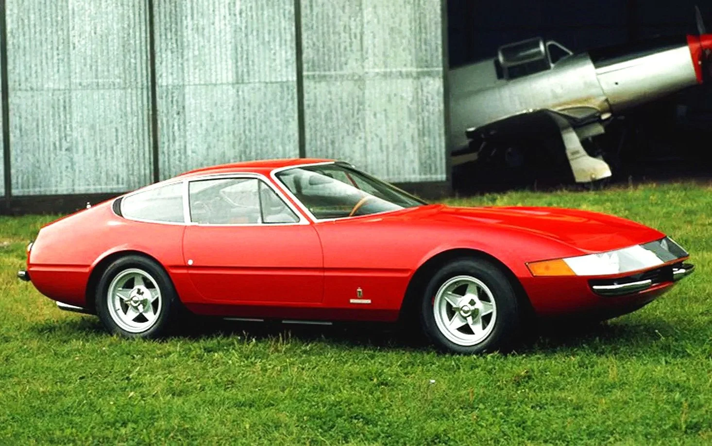 Original factory press photo of a red 1968 Ferrari 365gtb Daytona. Click to view the complete Ferrari vintage print advertisement and brochure gallery.