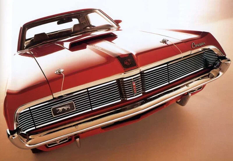 Link to the Mercury Cougar original advertisement archive (1967-1977) featuring high-resolution scans of the XR-7, Eliminator, and classic Sign of the Cat muscle car marketing.