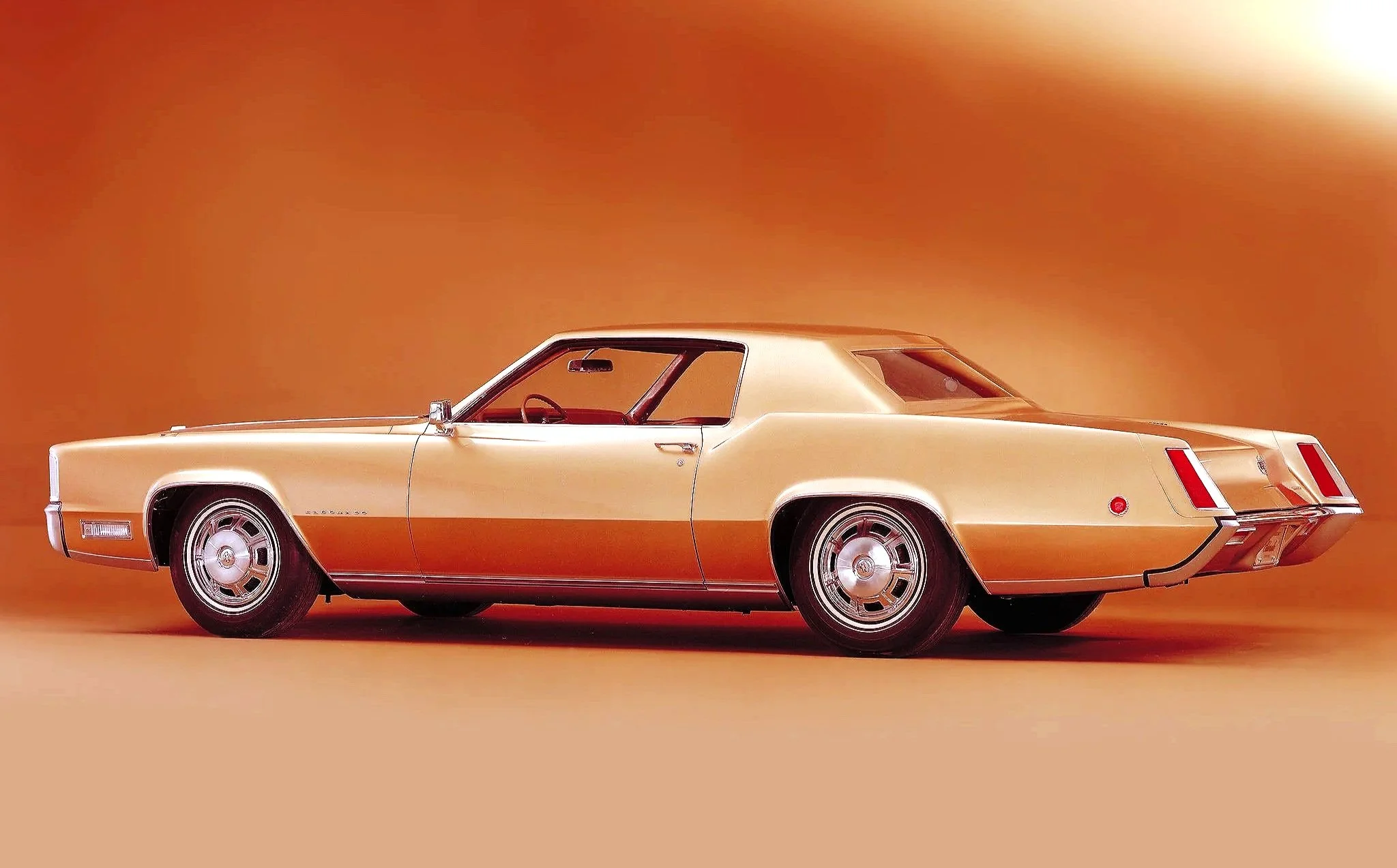 Link to the dedicated Cadillac Eldorado original advertisement archive (1967–1980s) featuring high-resolution scans, front-wheel-drive design specs, and vintage personal luxury car marketing.