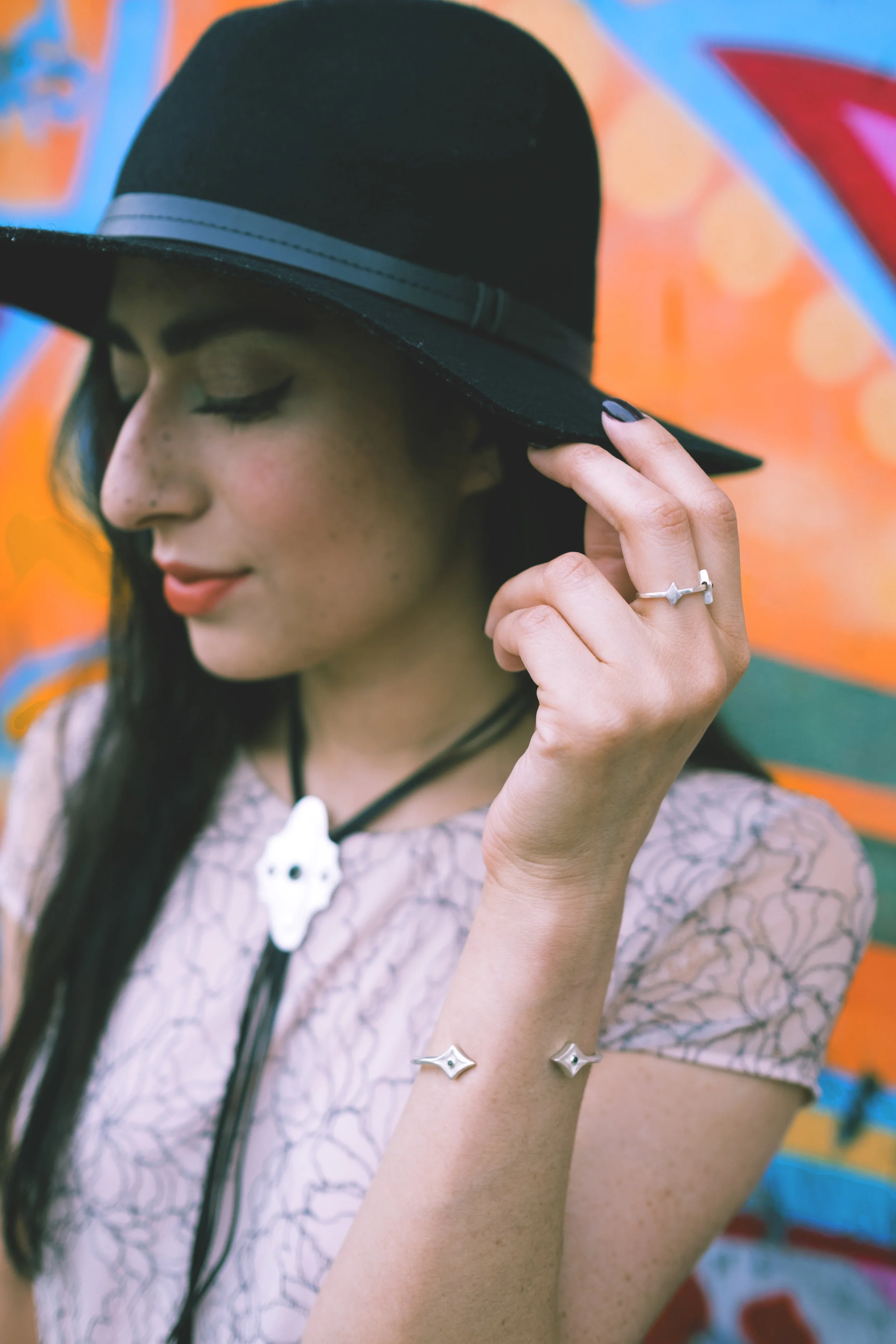 Wearing the Woven Trails Bolo Tie, Desert Night Ring, and Noche Negra Bracelet.