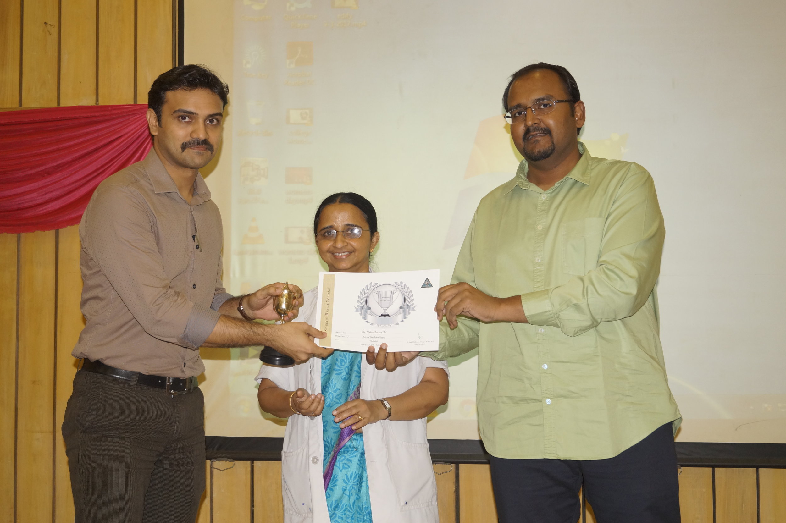 Dr. Nabeel receiving the Punctuality Award.