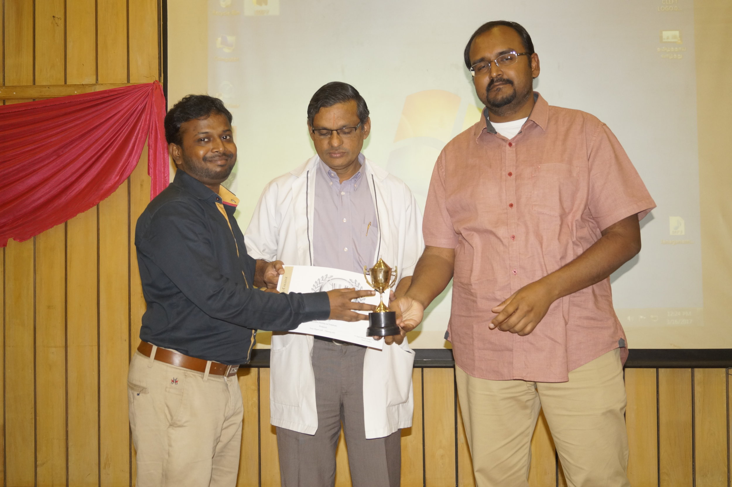 Dr. Pradeep receiving Workaholic Award