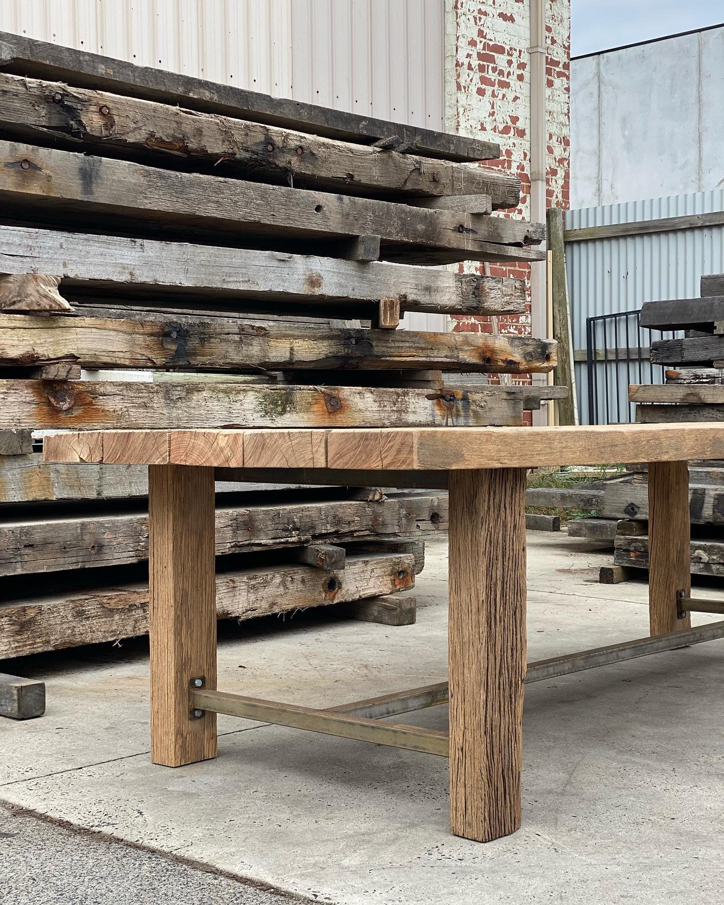An outdoor table made with timber salvaged from St Kilda pier. 👍⚒️🌳