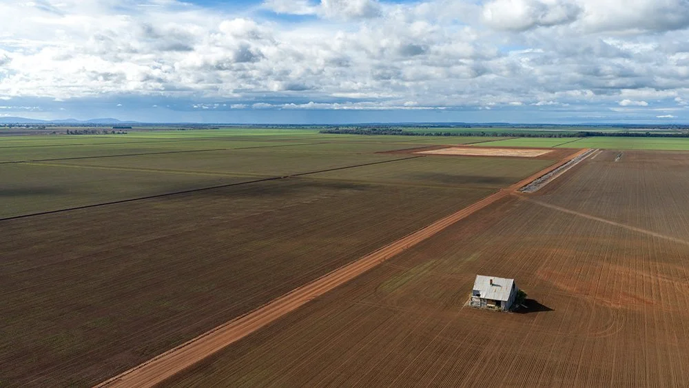 Drone aerial photography shot in rural Queensland of an old home on flat expansive pastures