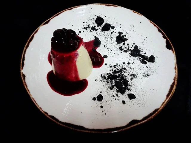 Getting into the #darkmofo spirit with our dessert special |💃🍒vanilla bean bavarois, black cherry, charcoal meringue and wild berry syrup