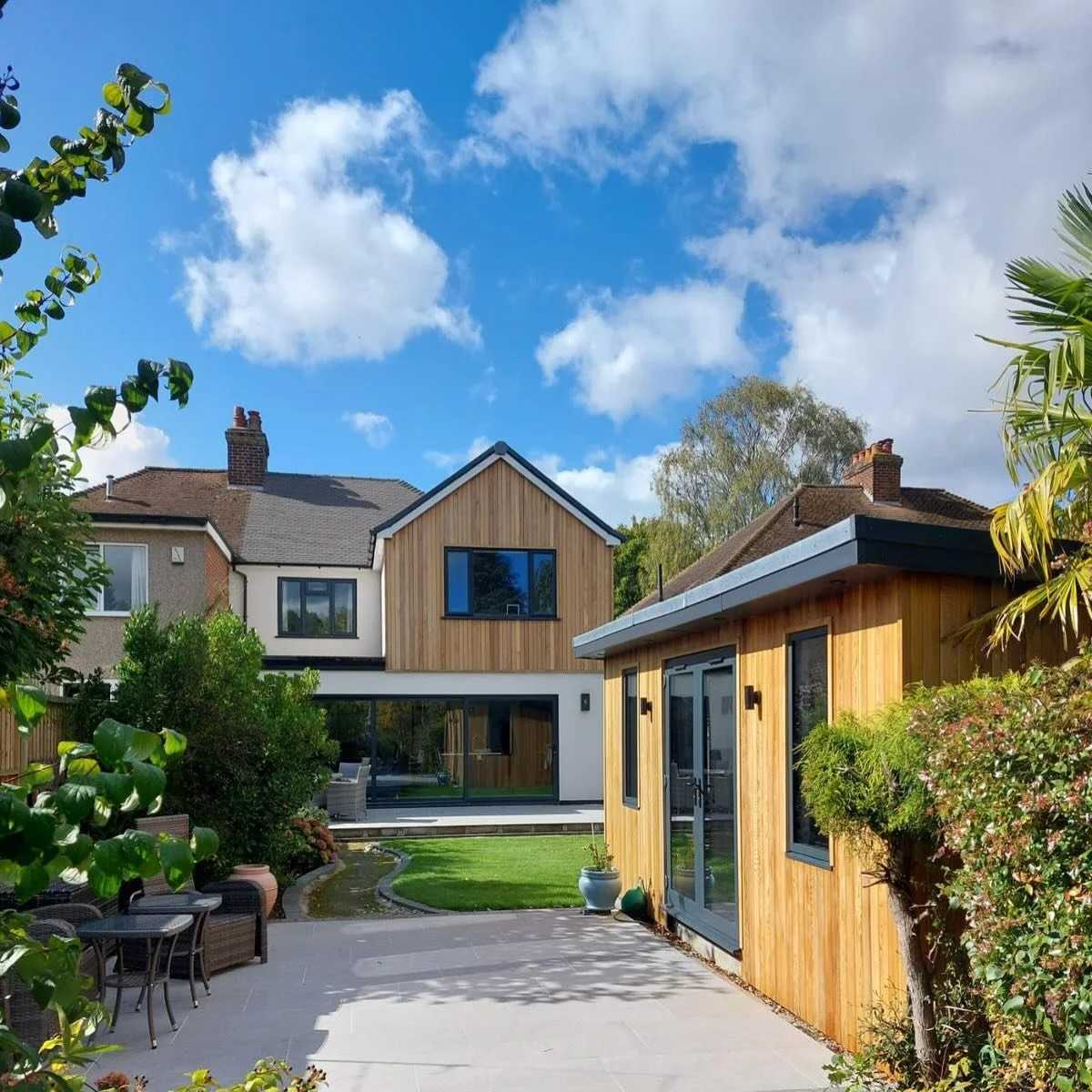Broughton

A contemporary two storey rear extension finished in Orpington.

The cedar-clad rear gable is the defining feature of this property bringing some warmth and texture to the elevation. The large sliding doors frame the generous garden area w