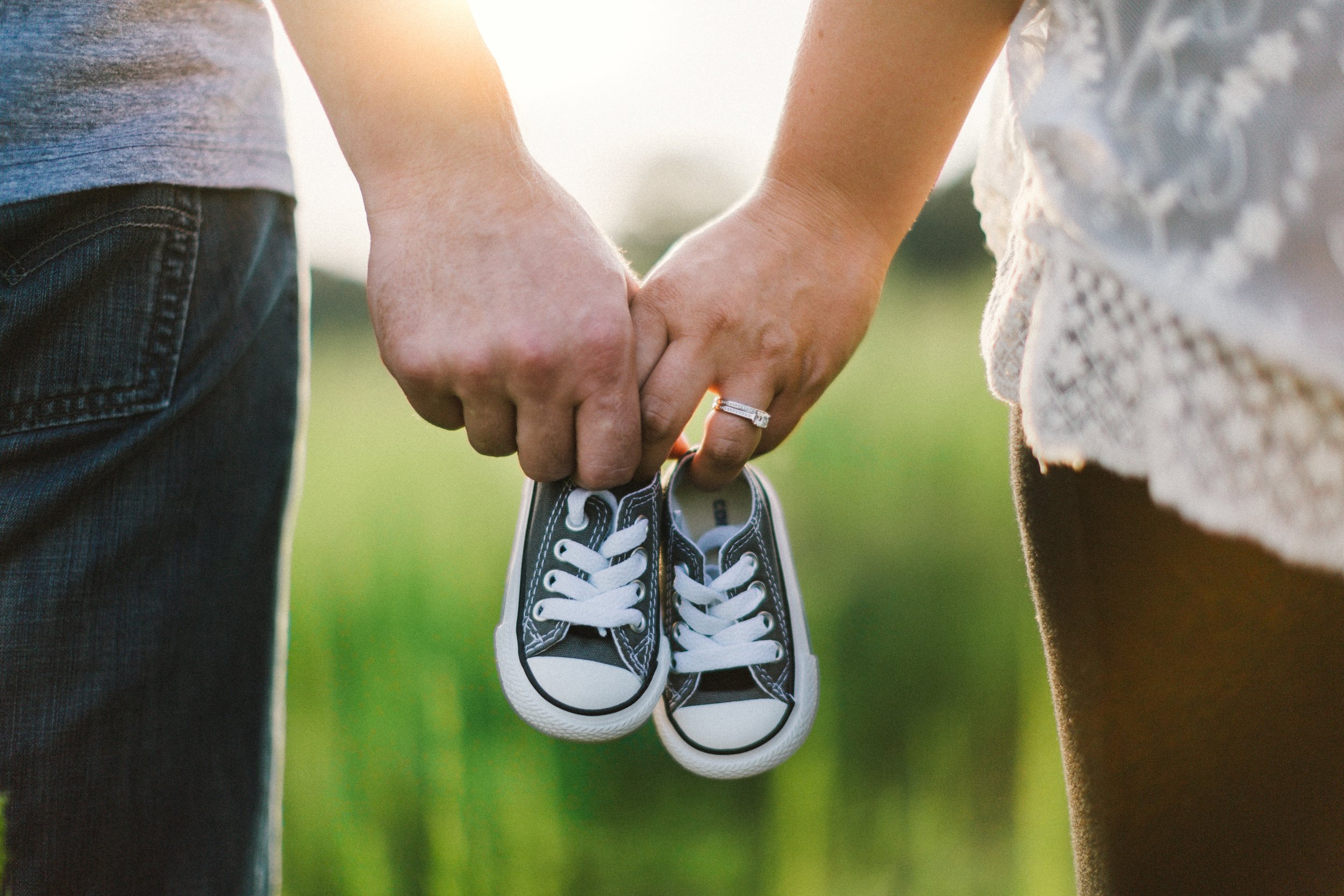 couple with baby shoes.jpg