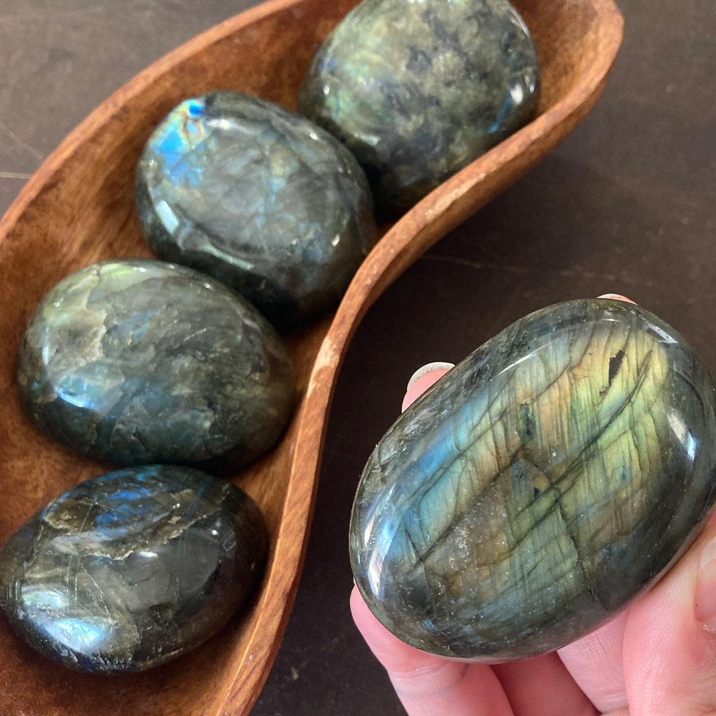 New large labradorite palmstones! Each has beautiful flash and some black tourmaline ✨
Only available via dms or in person right now but in order the ones shown are $17, $19 and $20. 

Known as the stone of magic, Labradorite really captures what mys