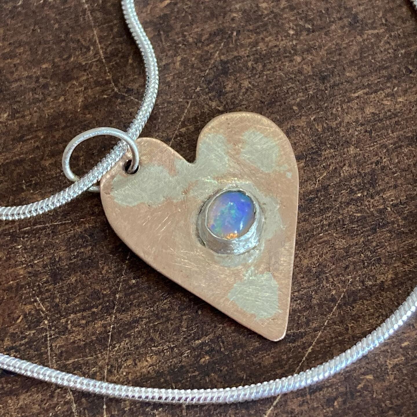 A striking blue Opal I just nestled into this sweet textured copper &amp; silver heart 💙

On an 18&rdquo; sterling silver chain
$37 

#opal #silverjewelry #silver #silversmithing #crystaljewelry #crystalhealing #gemstones #copper #shipshewana #love