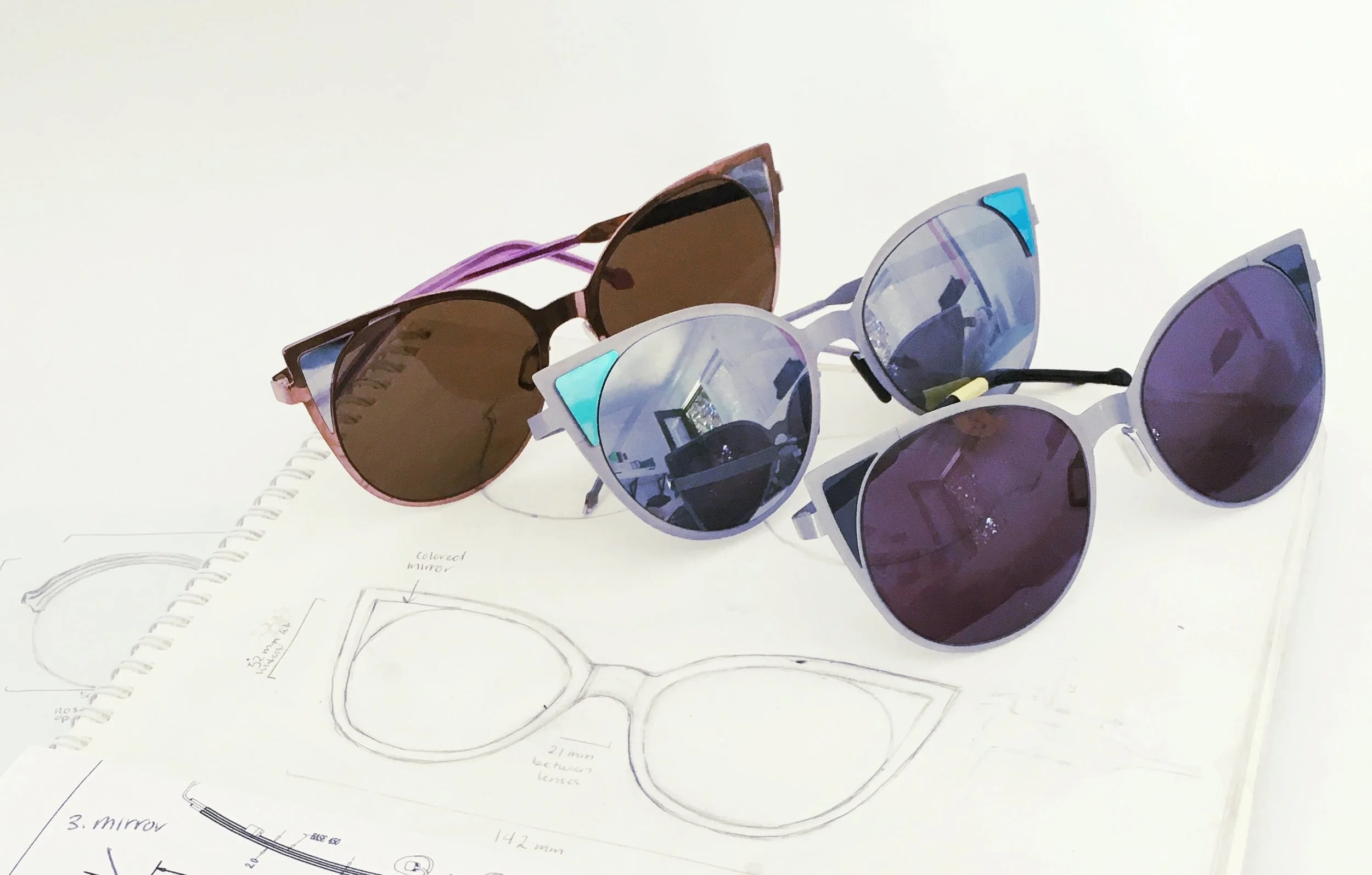 The evolution of prototypes. The triangles were originally planned to be mirrors, but after testing several ways to "install" them, we finally tried acetate and liked it much more.