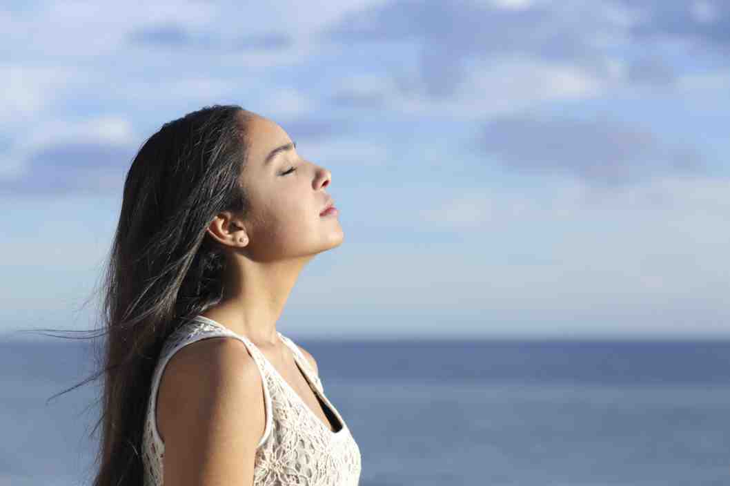Profile of a woman breathing fresh air. Photo: AntonioGuillem/Getty Images