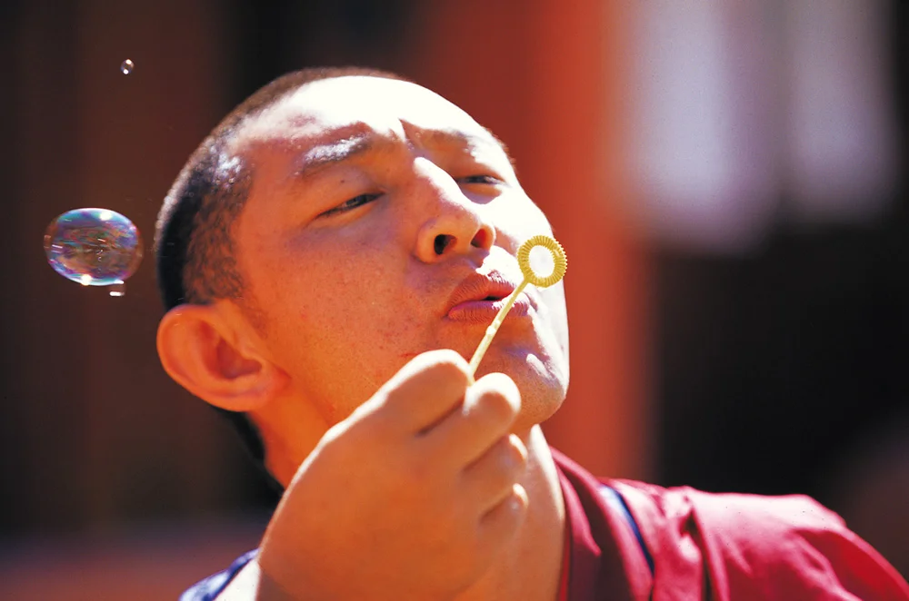 Monk_blowing_a_bubble_by_sharadhaksar.jpg