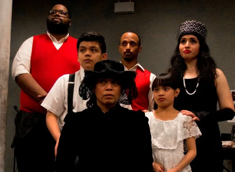 Jason Pereira (rear, center), stars as The Son in Ghostlight Ensemble's production of Six Characters in Search of an Author through May 7. (Photo by by Katie Jarecki)
