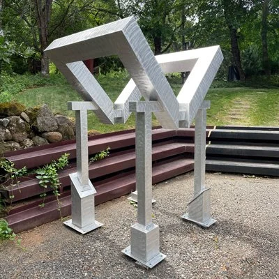 Geometric drawing of an outline square with sections divided by vertical, horizontal, and diagonal lines.