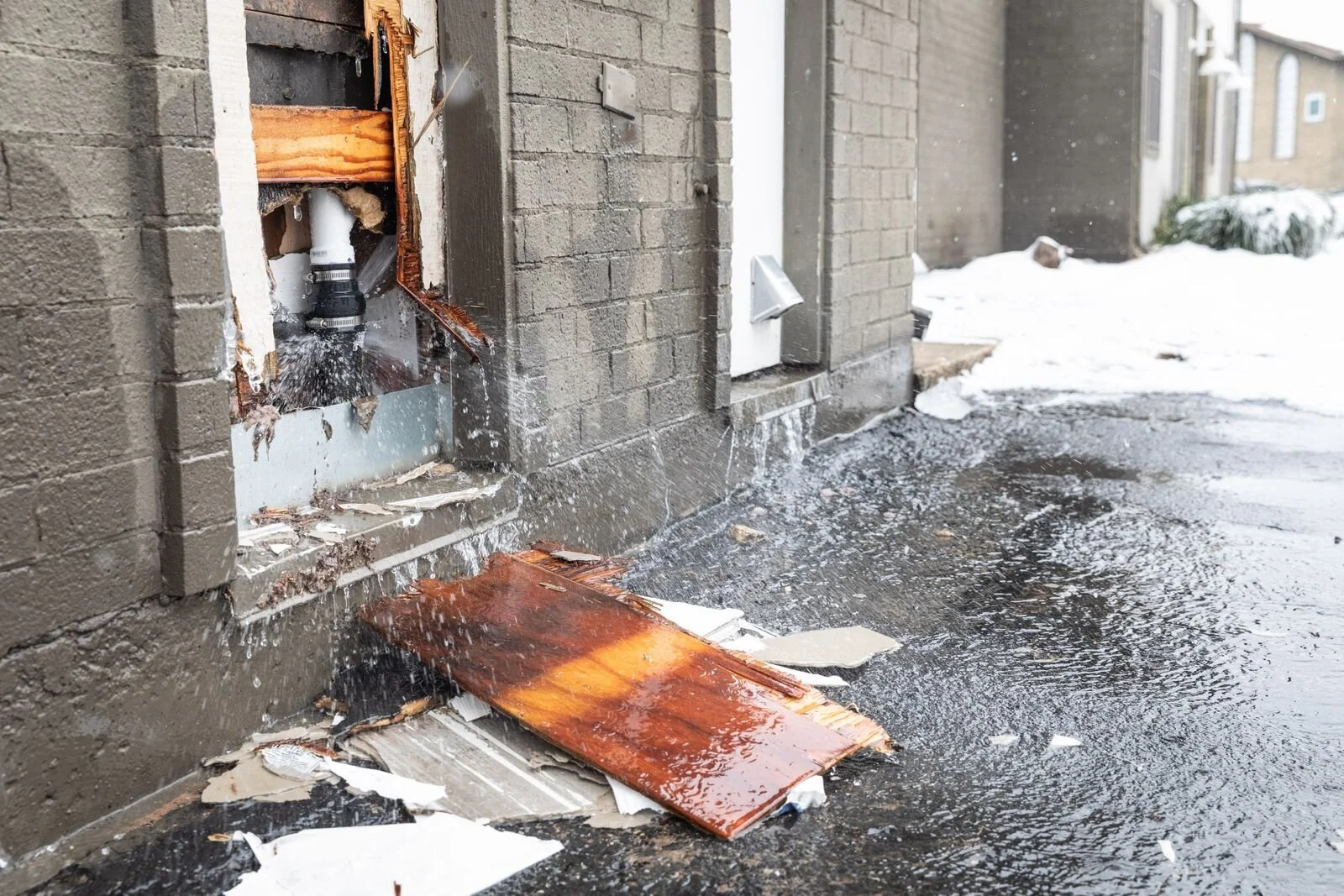 Water flows out from a burst water pipe in Austin, Texas, on Feb. 18.Photographer: Thomas Ryan Allison/Bloomberg